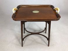 Tray table with horn handles and silver metal cartouche to centre (A/F), approx 64cm x 43cm x 71cm