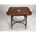 Tray table with horn handles and silver metal cartouche to centre (A/F), approx 64cm x 43cm x 71cm