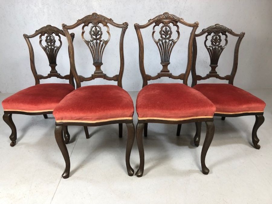 Set of four ornate velvet seated chairs, two small with castors to front feet