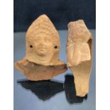 Two moulded pottery fragments depicting figures, possibly Roman period, the taller approx 9cm in