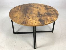 Modern circular coffee table on black metal base, approx 80cm in diameter x 46cm tall