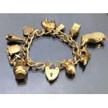 9ct Gold Charm bracelet, each link hallmarked 375 and charms also hallmarked with 9ct Gold heart