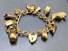 9ct Gold Charm bracelet, each link hallmarked 375 and charms also hallmarked with 9ct Gold heart