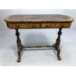 Victorian walnut writing table with leather inset top on two turned columns on four outswept