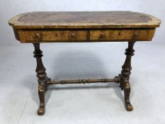 Victorian walnut writing table with leather inset top on two turned columns on four outswept