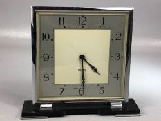 Smiths Clock, an 8 day Art Deco timepiece with square silvered dial, contained in a chrome case 16cm