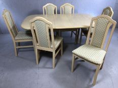 Pale wood extending dining table with six chairs, table approx. 117cm x 89cm