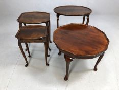 Small collection of dark wood furniture, two side tables and a small next of tables, all on Queen