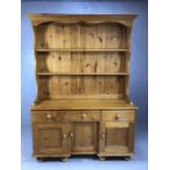 Pine dresser with three drawers and three cupboards under, shelves over, approx 134cm x 45cm x 190cm