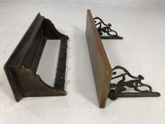 Pair of antique wooden wall shelves, the longest with wrought iron bracket depicting a knight,