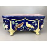 Victorian majolica oblong planter with bird design on a blue background and pink interior glaze,