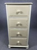 Tall white painted chest of four deep drawers on bun feet, approx 56cm x 52cm x 111cm tall