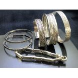Collection of six silver and silver coloured bangles
