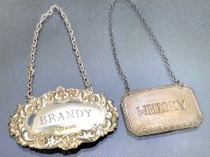 Two Silver hallmarked decanter labels on chains for Whisky and Brandy