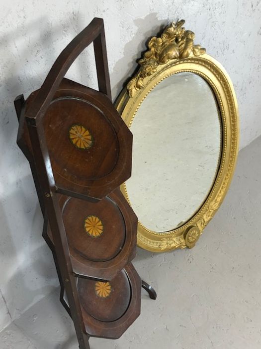 Gilt framed oval mirror and a three tier inlaid folding cake stand - Image 3 of 3