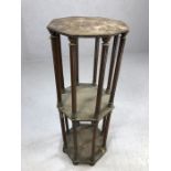 Interesting two tier plant stand on carved columns and bun feet, octagonal in shape, approx 75cm