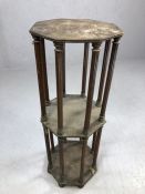 Interesting two tier plant stand on carved columns and bun feet, octagonal in shape, approx 75cm