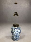 Blue and white ceramic lamp base with brass fittings and makers mark to base, approx 80cm tall