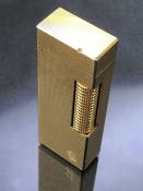 Vintage Dunhill gold plated lighter, approx 6.5cm in height