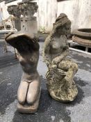 Two garden statues, one concrete, one bronze effect, of naked women, the tallest approx 60cm tall