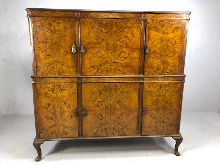 Large walnut drinks cabinet by maker S. &. H. Jewell, London, with three cupboards over and three