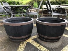 Pair of plastic barrel style lightweight garden planters, each approx 62cm in diameter