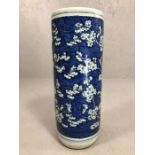 Chinese ceramic blue and white umbrella stand depicting blossoms, approx 22cm x 59cm