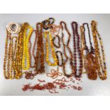 Large collection of Amber coloured beads/ Necklaces and Coral Jewellery