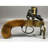An early 19th Century brass cased Flintlock tinderbox candle lighter, half cock & full cock,