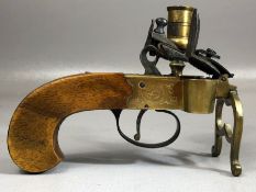 An early 19th Century brass cased Flintlock tinderbox candle lighter, half cock & full cock,