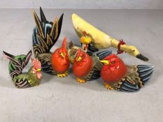 Collection of decorative wooden and ceramic cockerels and a duck