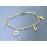 9ct Gold bracelet with the four letter word "LOVE" in gold letters approx 18cm long and 1.8g