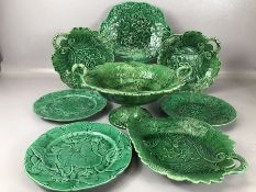 Majolica green glazed leaf design twin handled comport, along with seven leaf design plates in