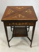 Victorian games table with tapering legs on original castors, with galleried shelf below, table