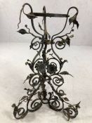 Wrought iron plant stand / holder of tripod form decorated with flowers and leaves, approx 53cm