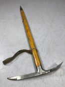 Stubai Austrian ice axe with a steel axe head, wooden handle, canvas strap and steel point to