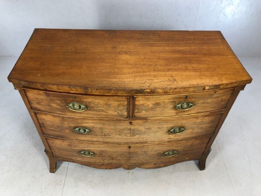 Victorian bow-fronted four drawer chest of drawers on splay front feet, approx 115cm x 55cm x 90cm - Image 2 of 8