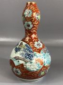 Chinese double gourd vase with six figure character mark to base, with bird design on orange ground,