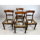 Set of four Victorian dining chairs with carved and shaped backs on turned front legs to include one