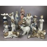 Good collection of Lladro and Nao ceramic figurines, 15 in total, to include praying nun, angels,