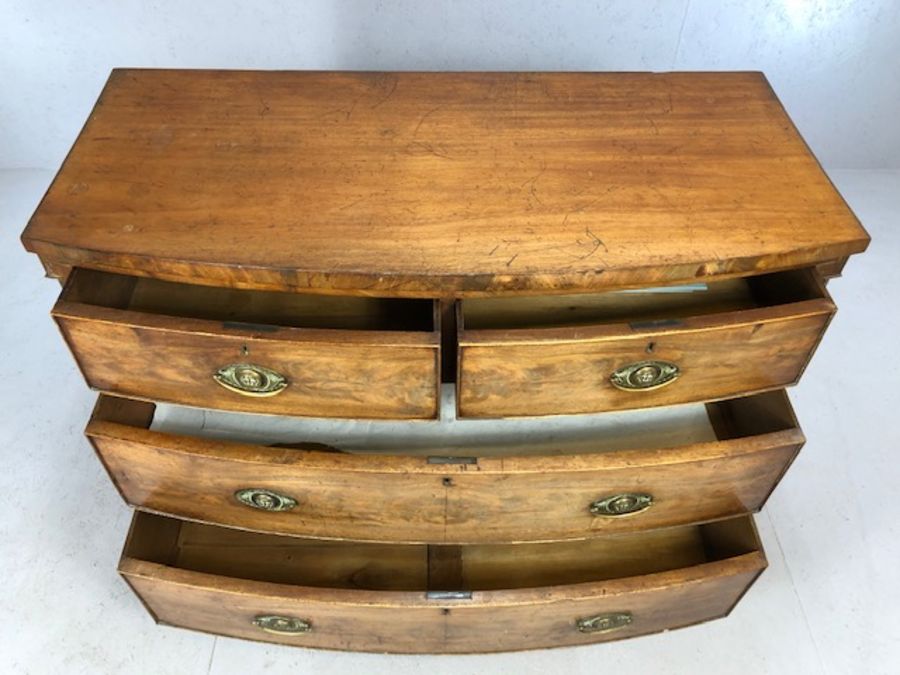 Victorian bow-fronted four drawer chest of drawers on splay front feet, approx 115cm x 55cm x 90cm - Image 5 of 8