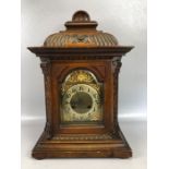 Continental oak cased mantel clock, brass dial with Arabic numerals, the brass movement stamped