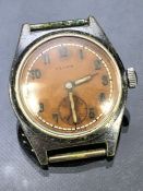 Vintage wristwatch by FEARS of Bristol Orange face with subsiduary seconds dial at 6 o'clock.