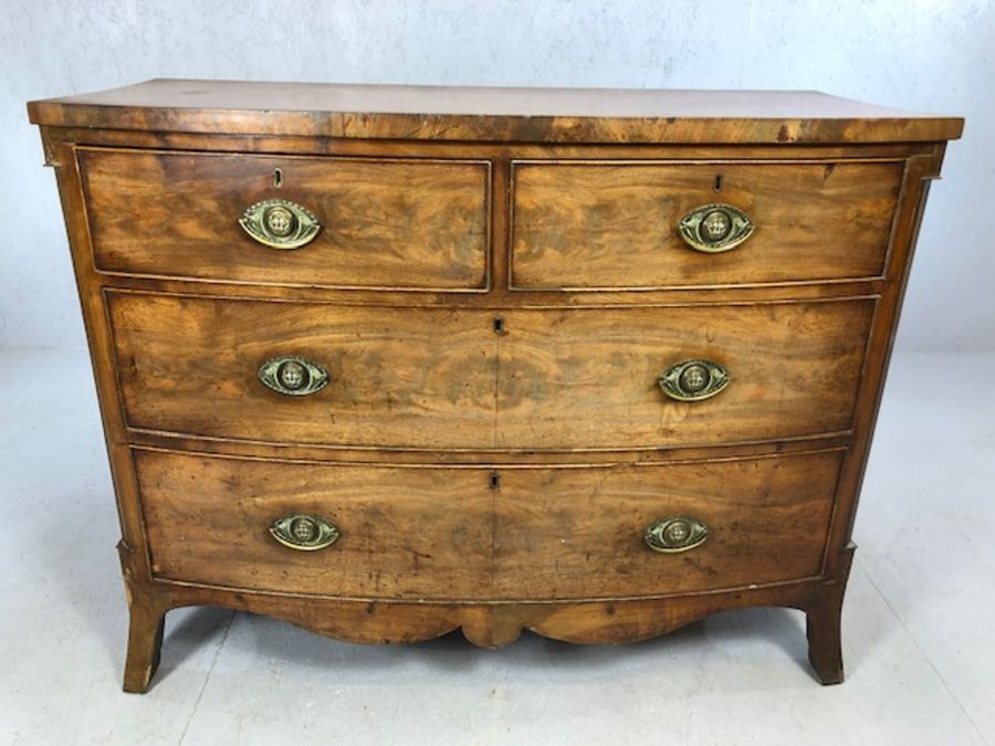 Victorian bow-fronted four drawer chest of drawers on splay front feet, approx 115cm x 55cm x 90cm