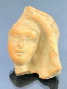 Terracotta fragmentary piece of a human figure, possibly Roman, approx 4.5cm in length