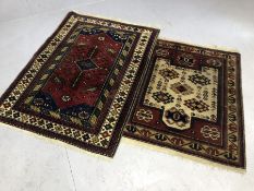Two vintage woollen rugs, the larger approx 134cm x 100cm