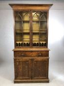 Breakfront bureau bookcase with cupboard and pull-out writing desk below and glazed book shelves