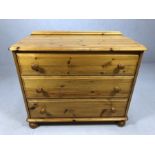 Pine chest of three drawers on bun feet, approx 90cm x 46cm x 75cm tall