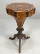 Octagonal inlaid sewing box / work table on heavily carved tripod legs, lid opening to reveal