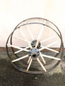 Two original wrought iron wagon wheels for ornamental garden purpose, each approx 63cm in diameter